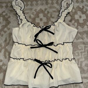 Cream Ruffled Crop Top with Black Trim and Bows
